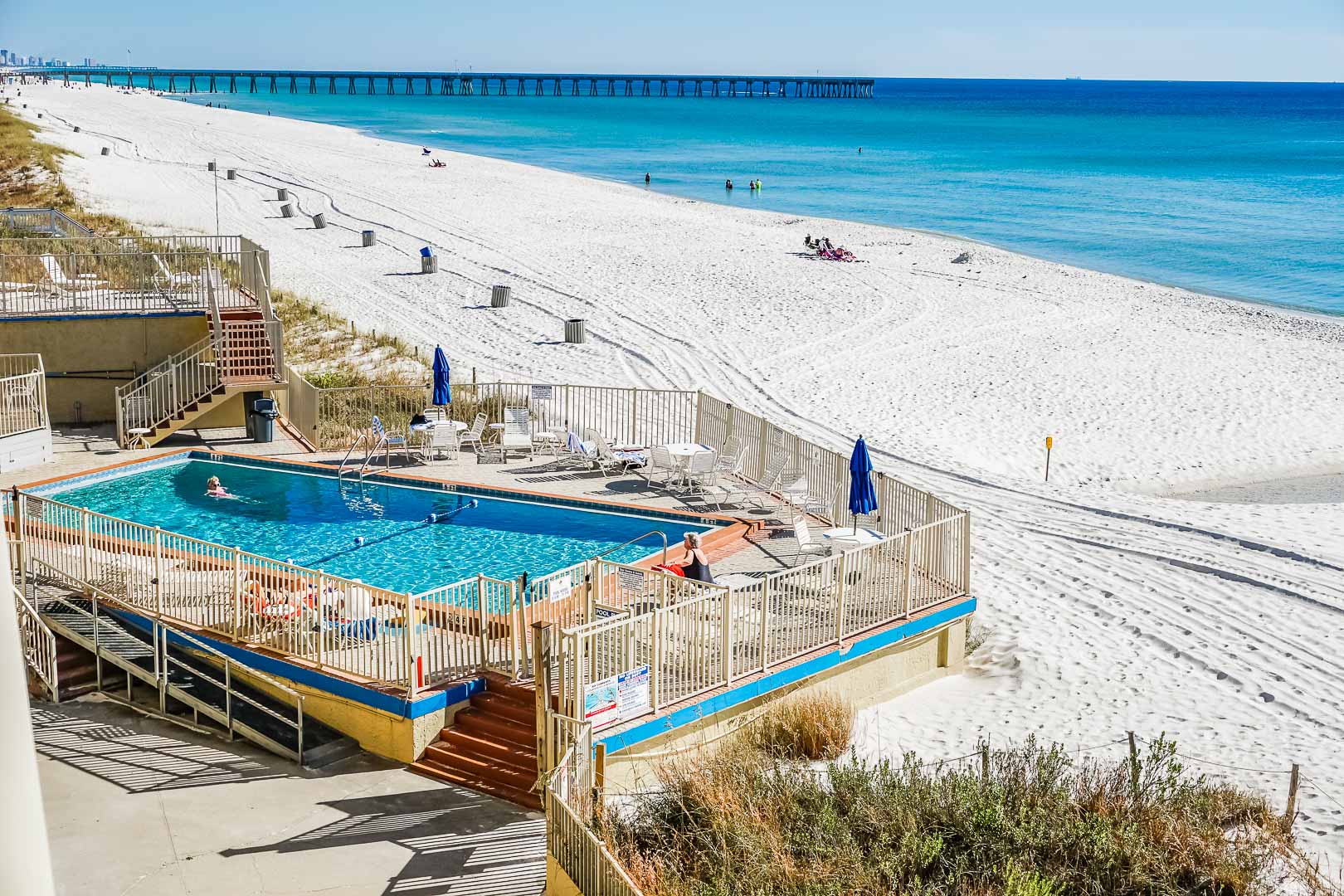 A refreshing pool with beach access at VRI's Panama City Resort & Club in Florida.